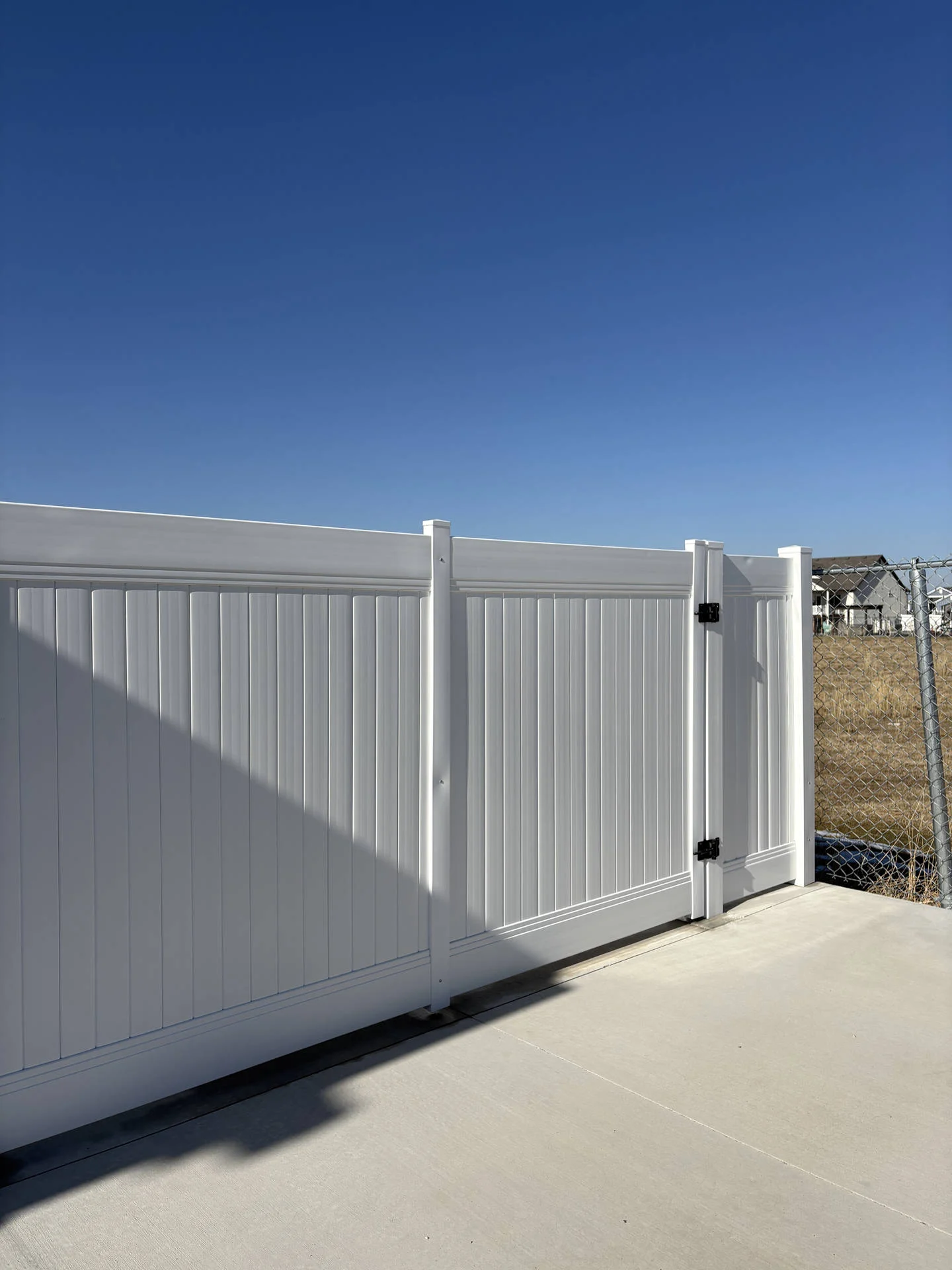 Hooper, UT: White Vinyl Privacy Fence & Gates Installed