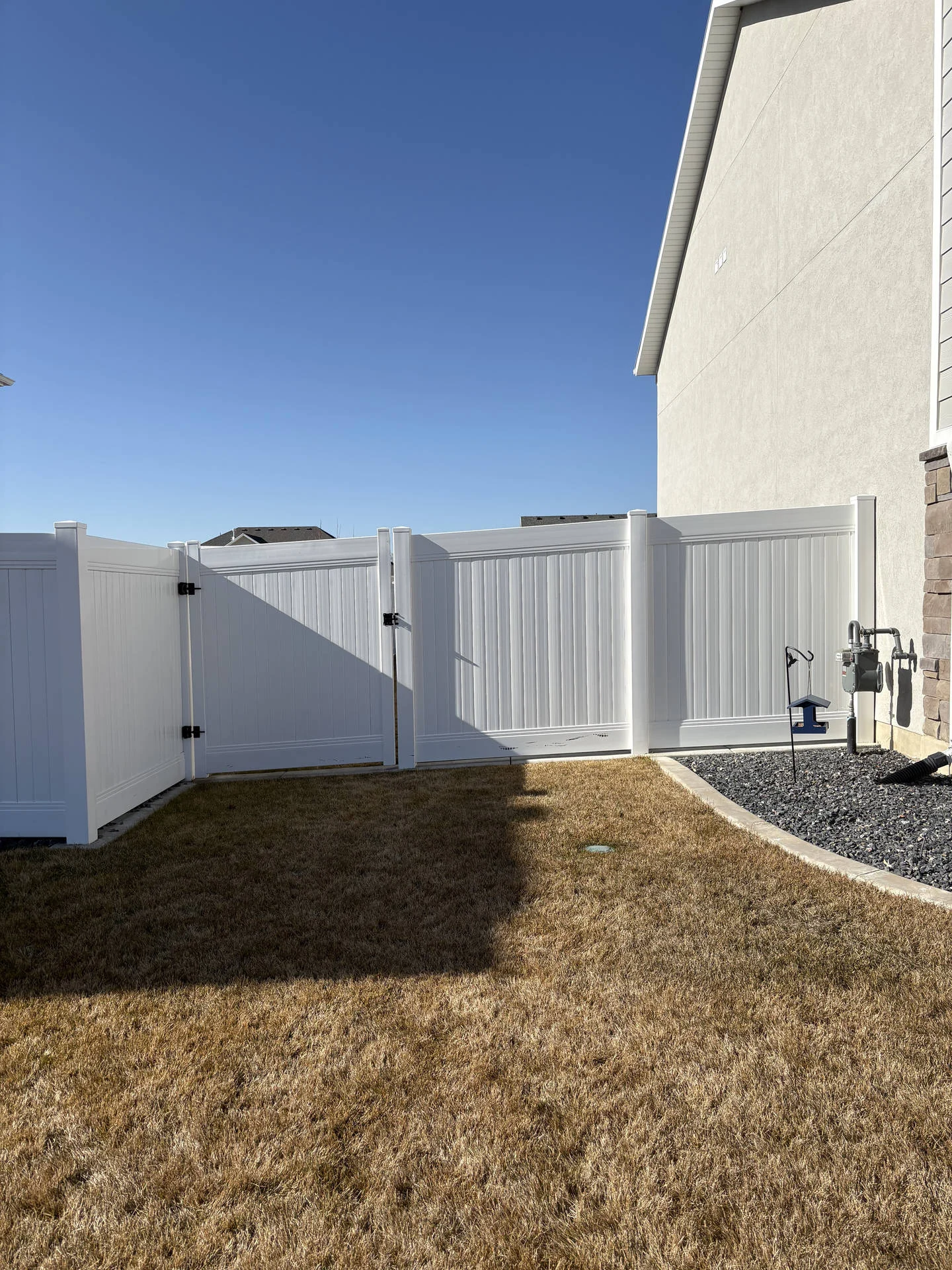 Hooper, UT: White Vinyl Privacy Fence & Gates Installed