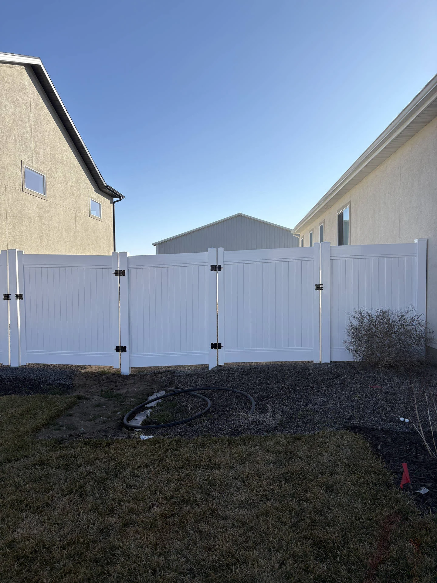 Taylor, UT: White Vinyl Privacy Fence & Double Gate