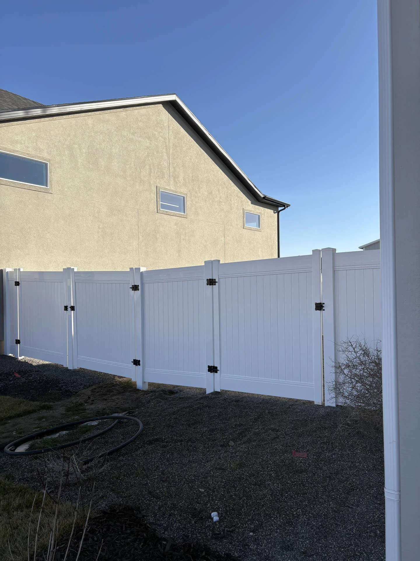 Taylor, UT: White Vinyl Privacy Fence & Double Gate