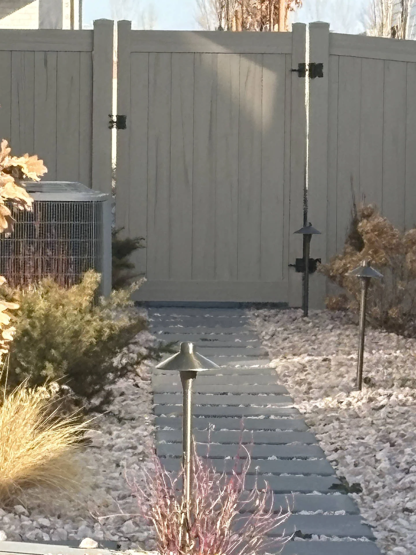 Driftwood Vinyl Fence with Steel Accents & Mow Strip