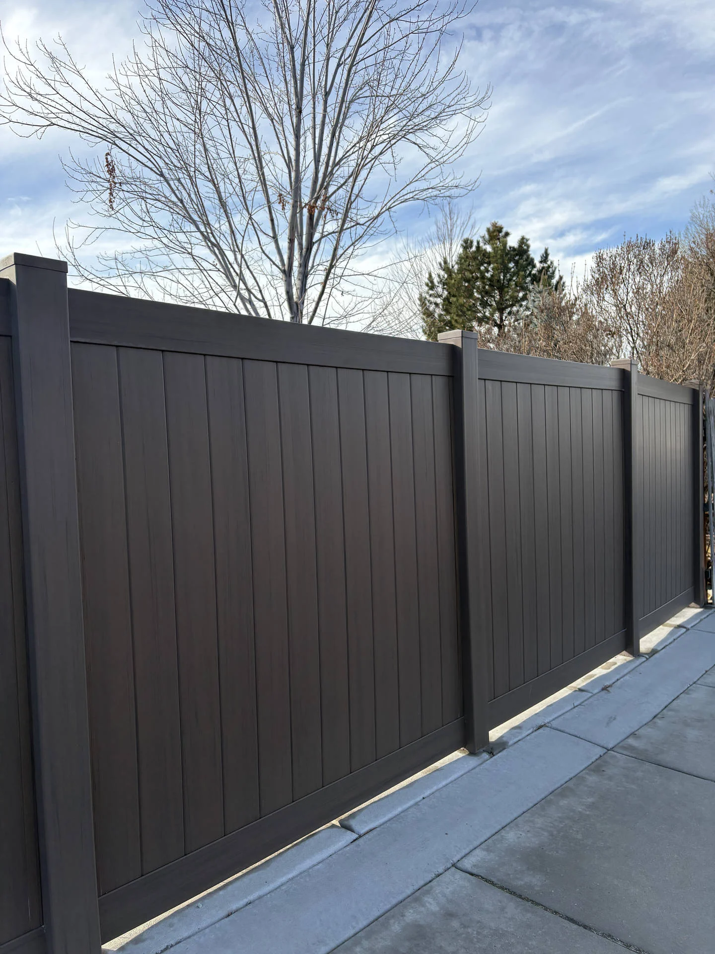 Dark Walnut Vinyl Fence with Robust Gates in Plain City, UT