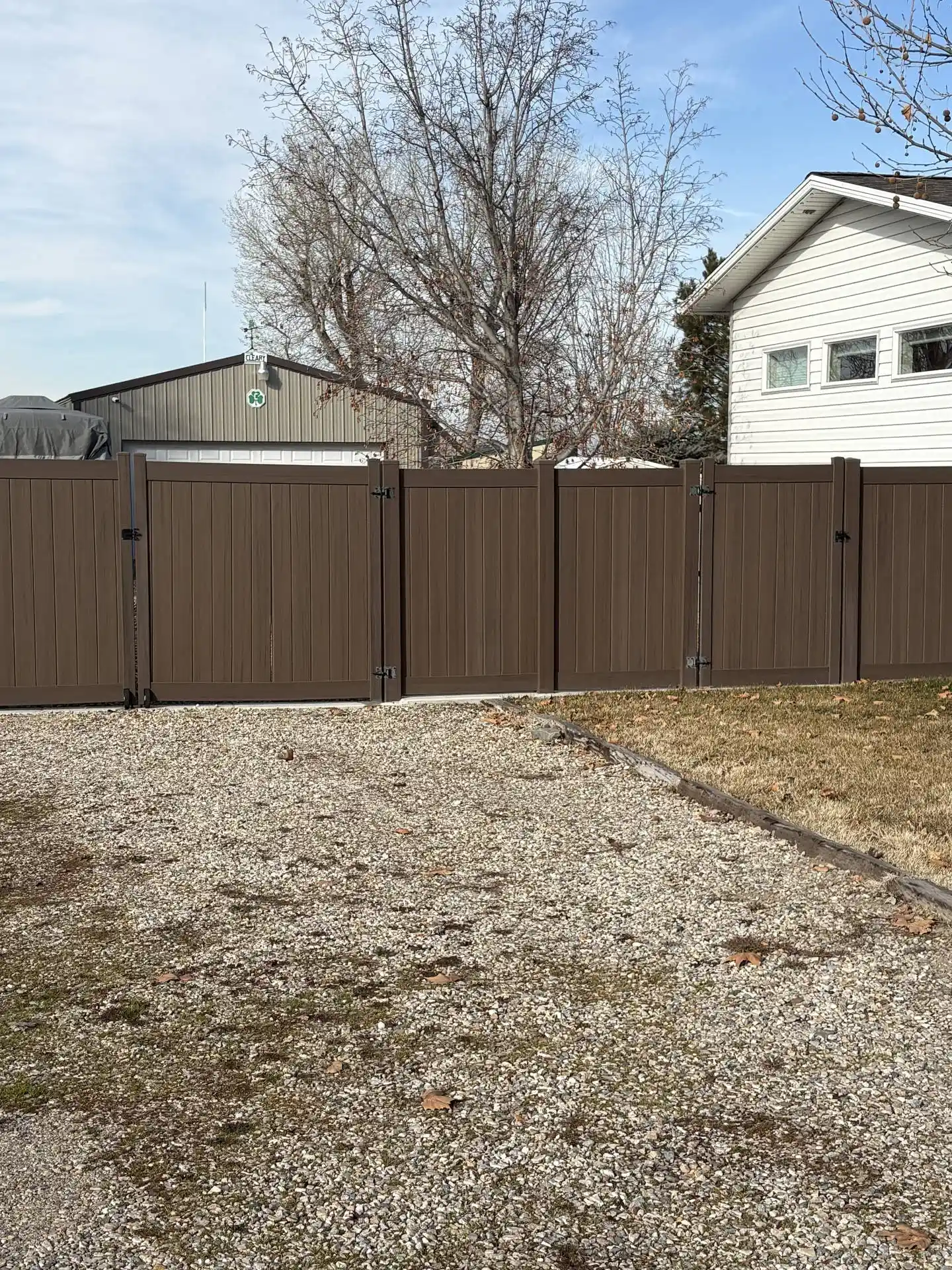 Dark Walnut Vinyl Fence with Robust Gates in Plain City, UT
