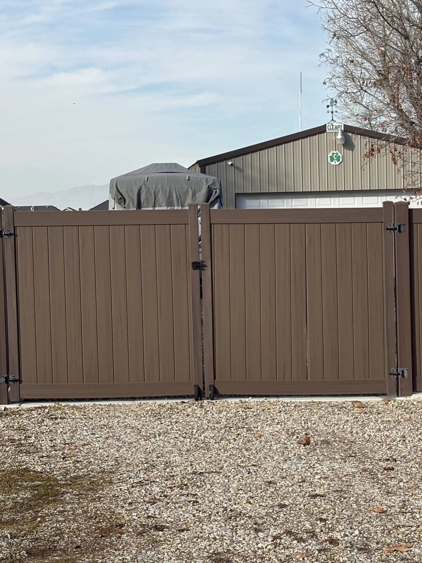 Dark Walnut Vinyl Fence with Robust Gates in Plain City, UT
