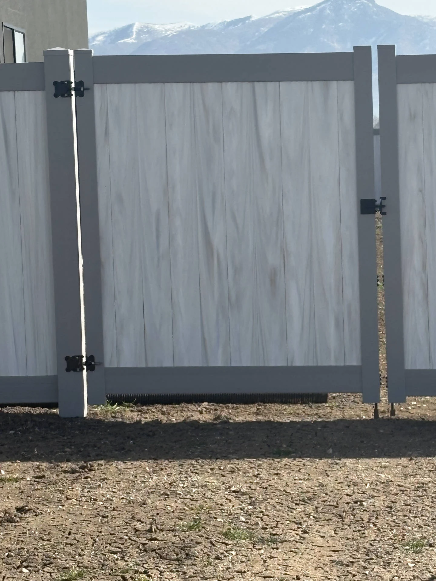 Plain City Privacy Fence: Aspen Pickets, Gray Posts, Black Hardware