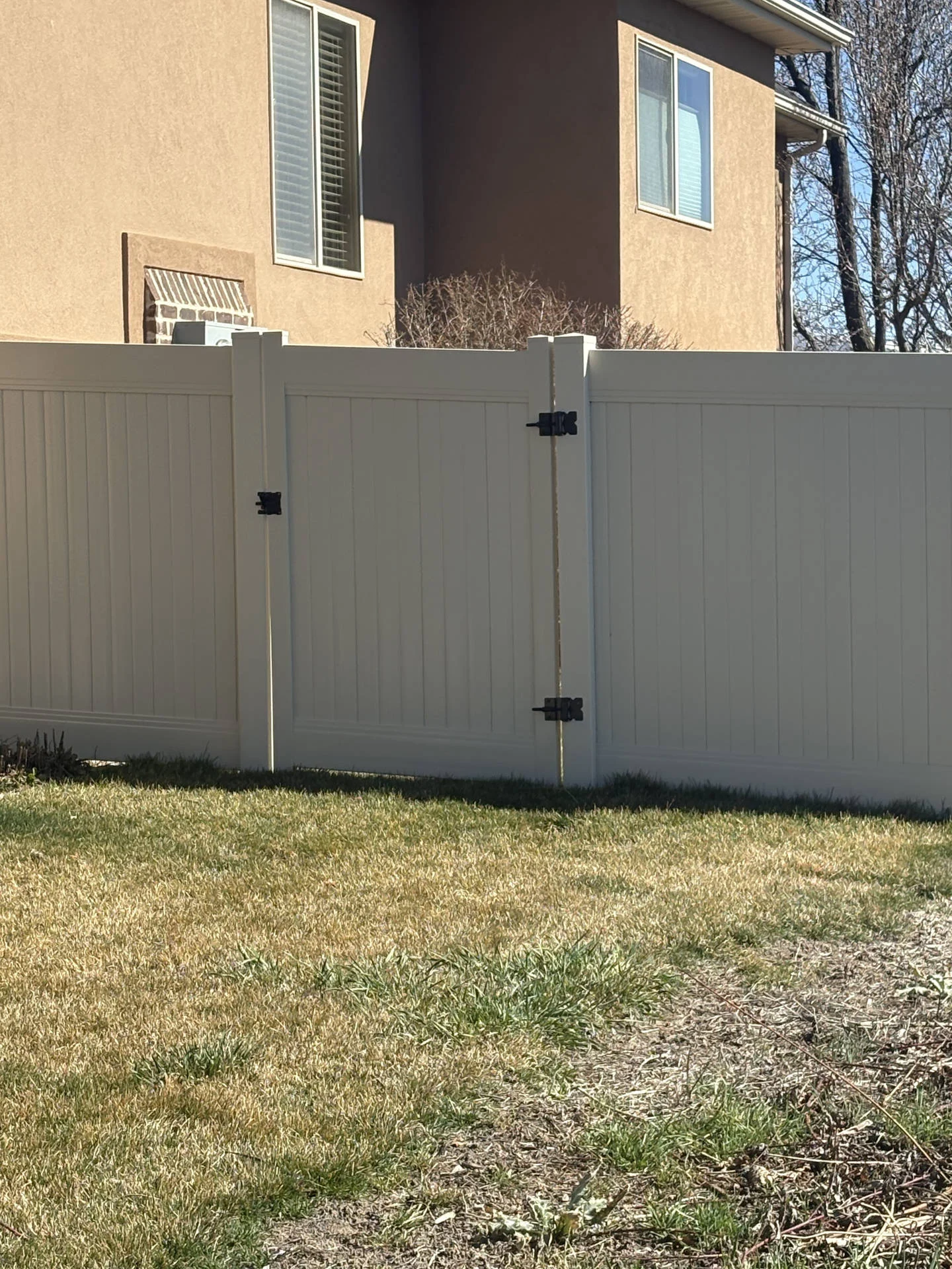 Kaysville Tan Vinyl Privacy Fence with Steel Accents