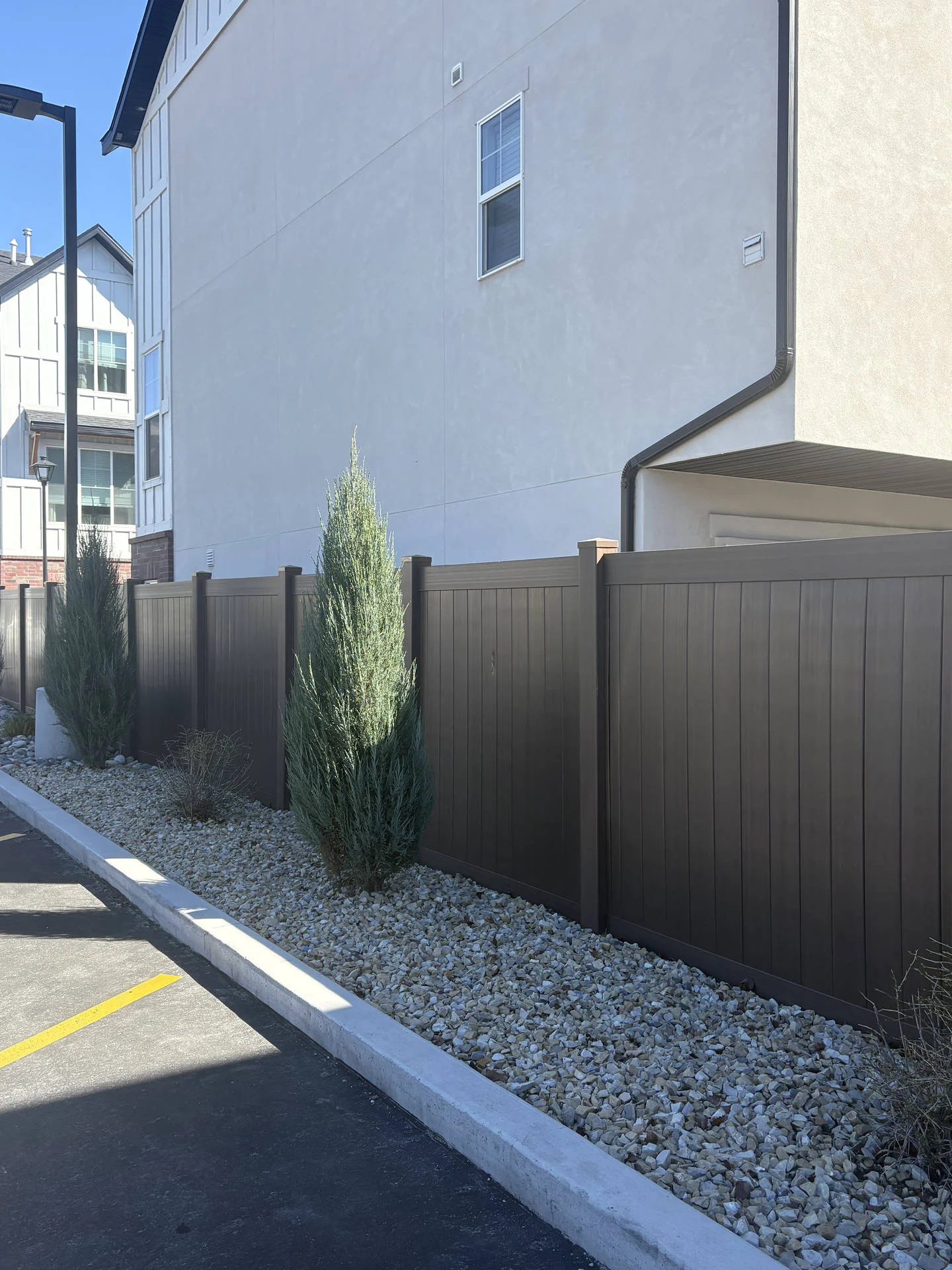 Layton UT: Dark Walnut Vinyl Privacy Fence Installation