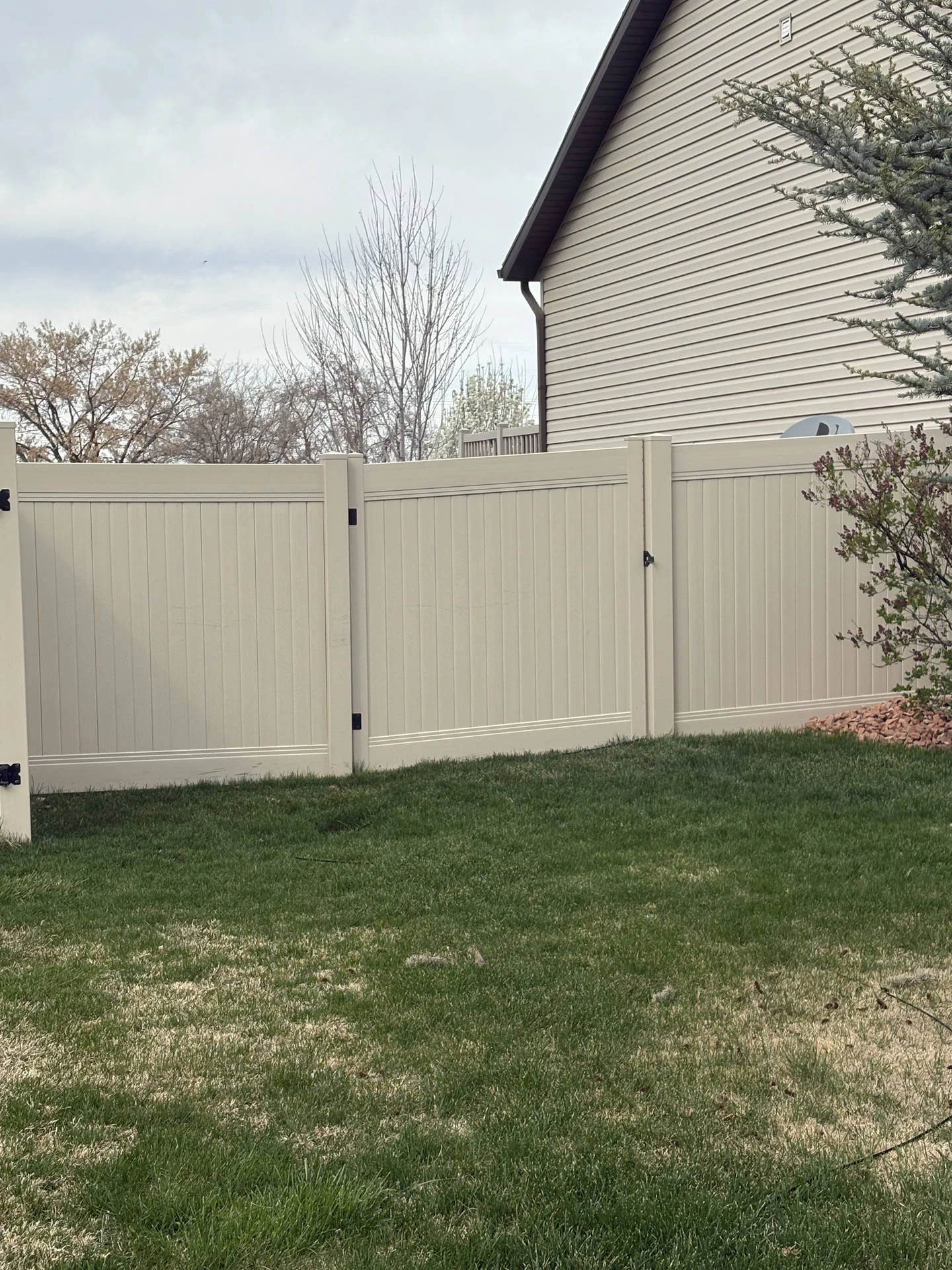 Roy, UT: Tan Vinyl Privacy Fence & Double Gates