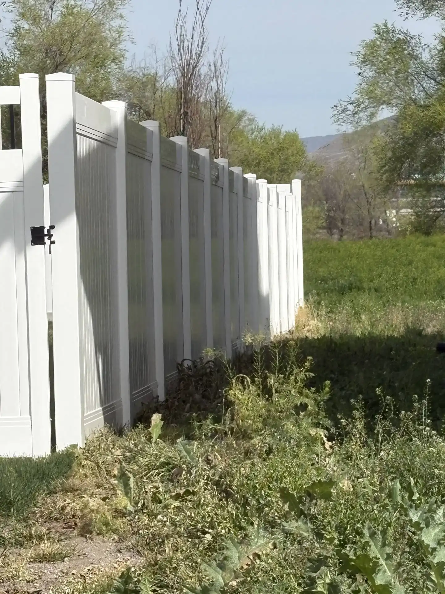 Farmington White Vinyl Privacy Fence with Black Accents