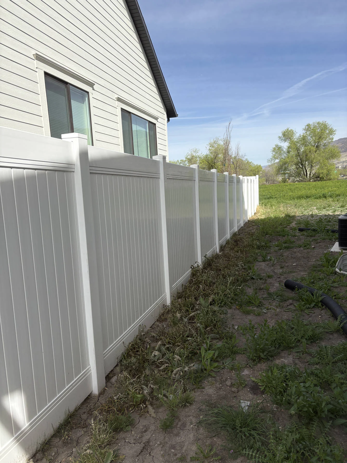 Farmington White Vinyl Privacy Fence with Black Accents