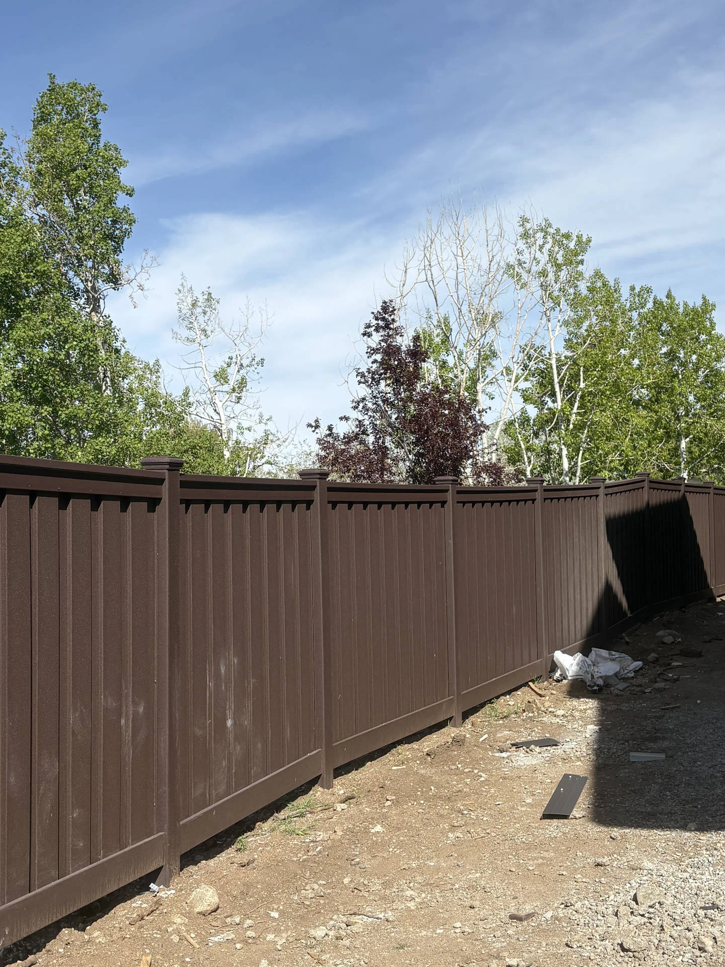 Woodland Brown Trex Privacy Fence for New Ogden Complex