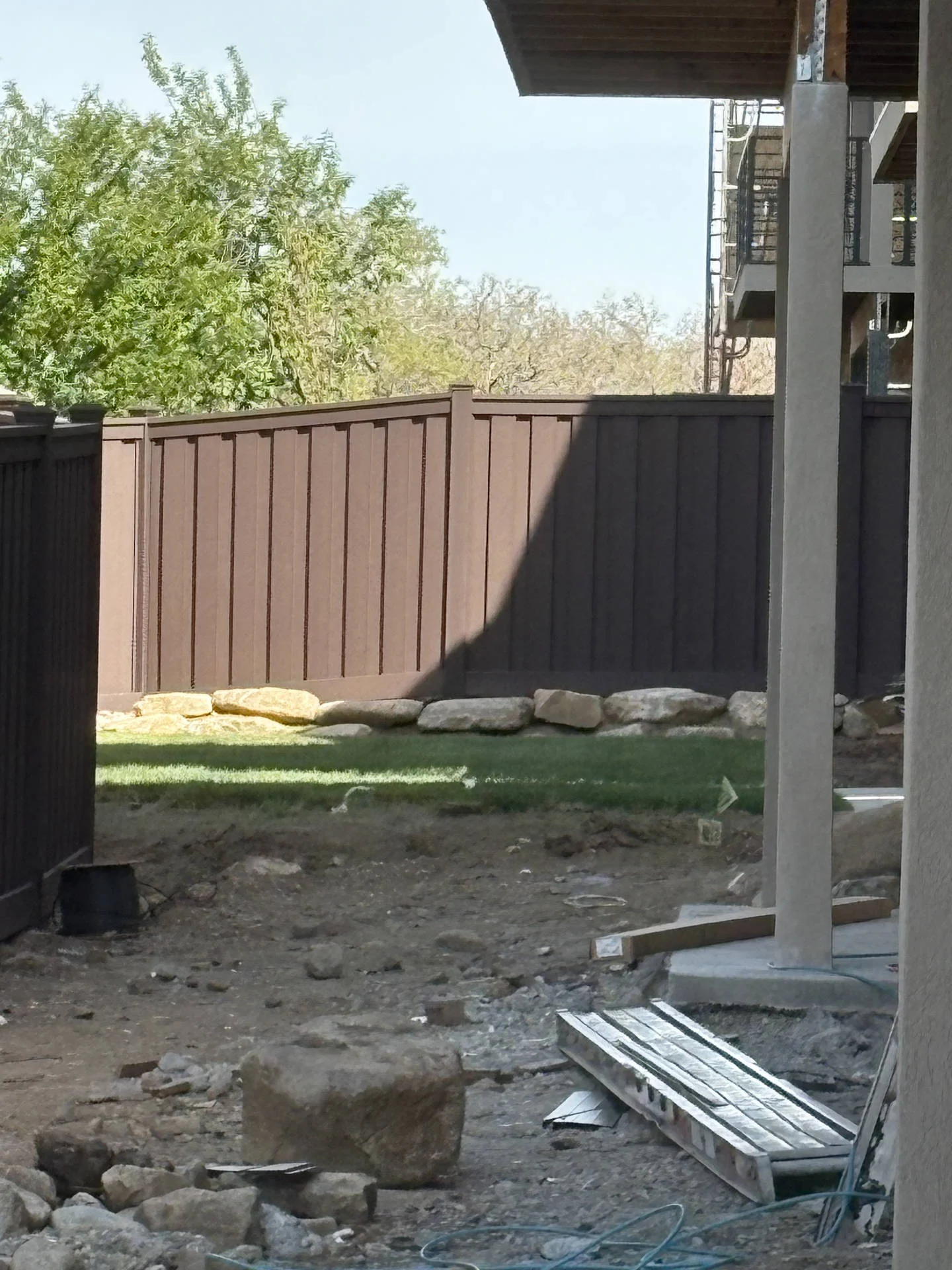 Woodland Brown Trex Privacy Fence for New Ogden Complex