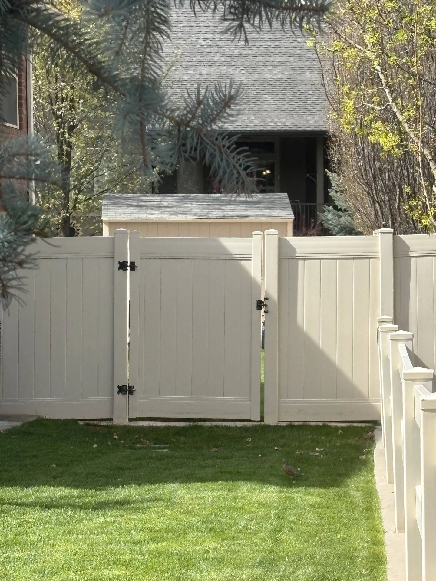 Mountain Green Tan Vinyl Fence with Heavy-Duty Gates