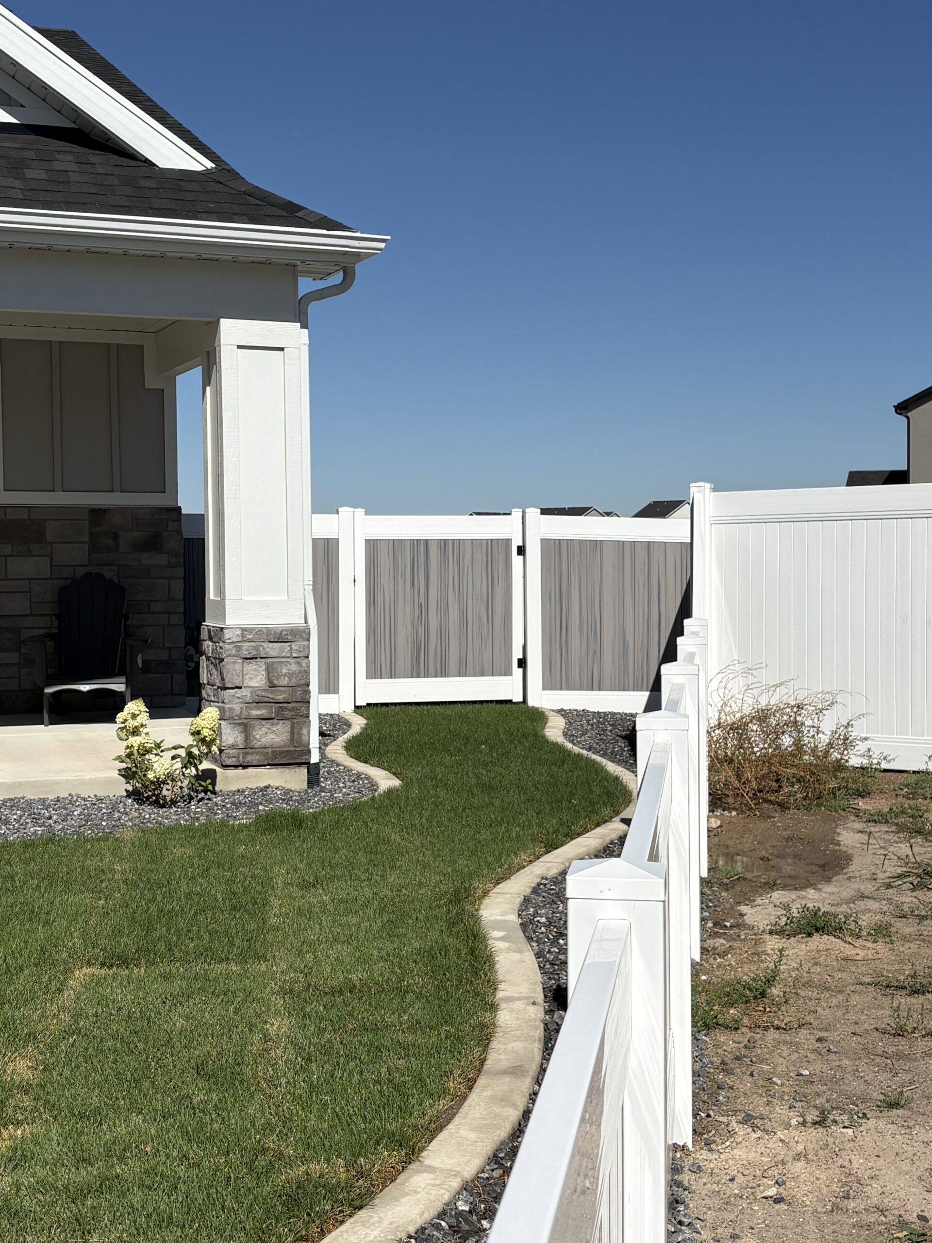 Two-Tone Vinyl and Cedar Privacy Fence in West Point