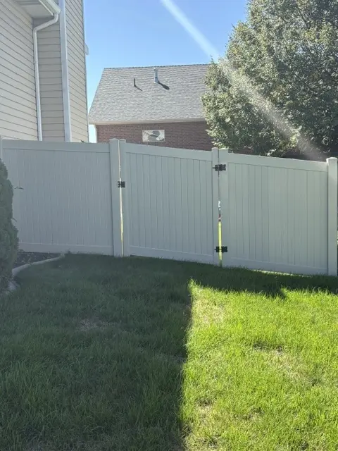 Durable Tan Vinyl Privacy Fence with Double Gate in West Point