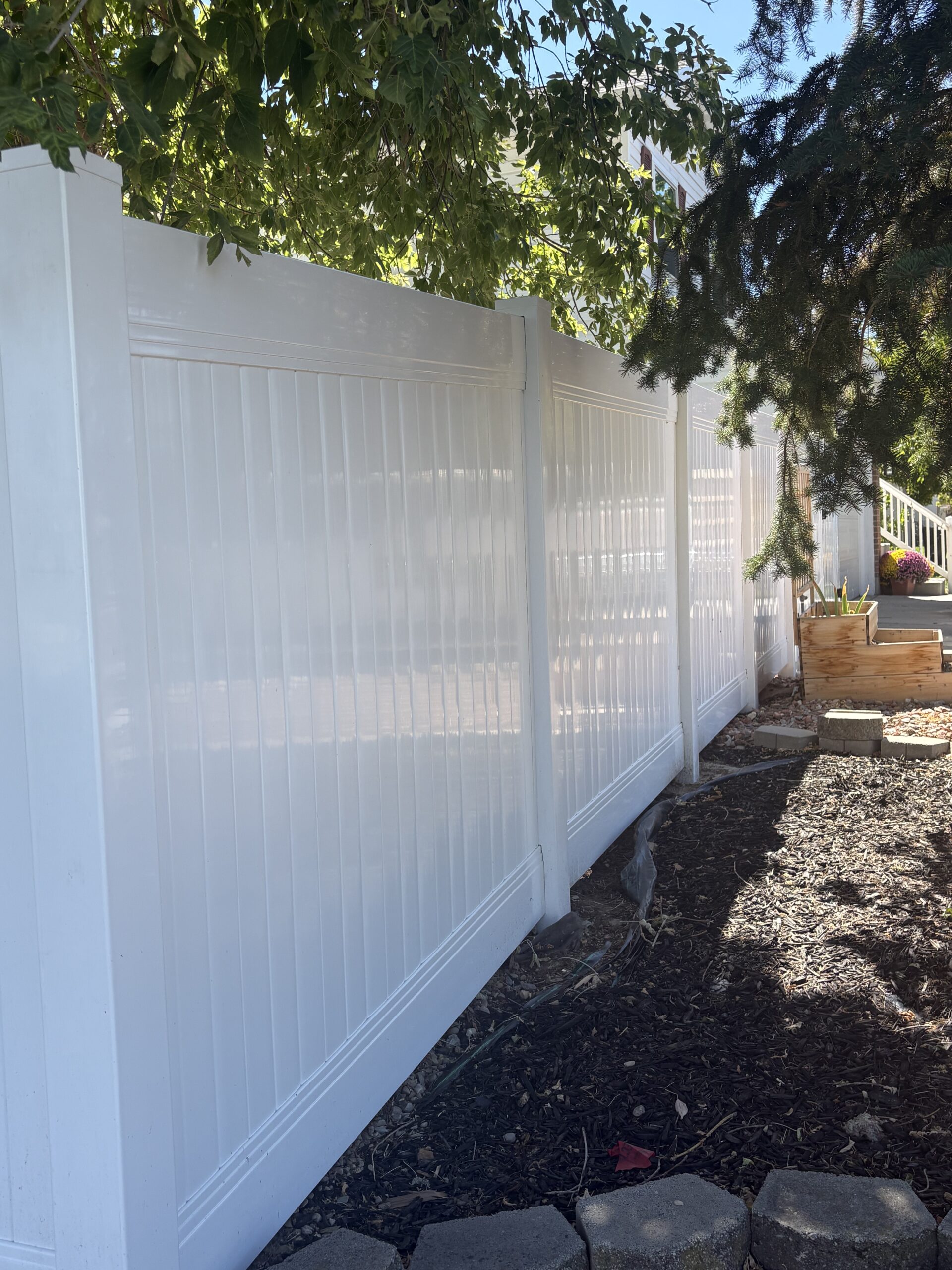 Durable White Vinyl Privacy Fence in Clinton UT