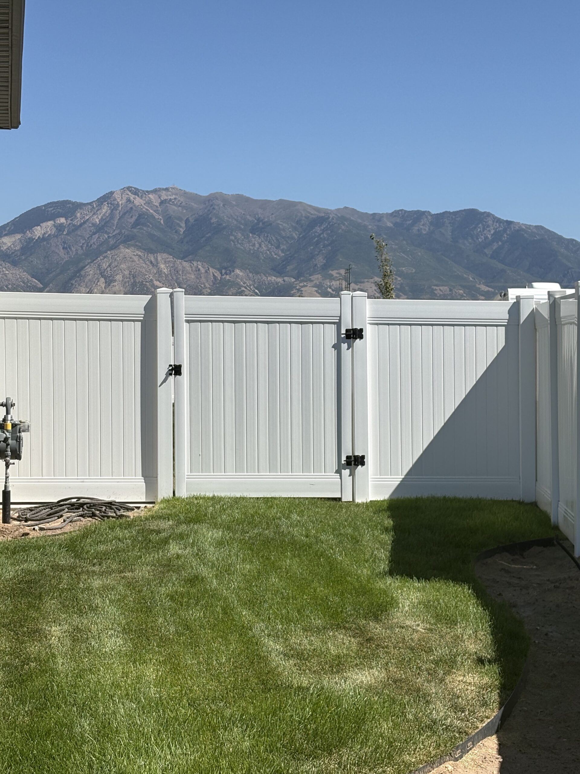Durable White Vinyl Privacy Fence and Mowstrip in West Haven