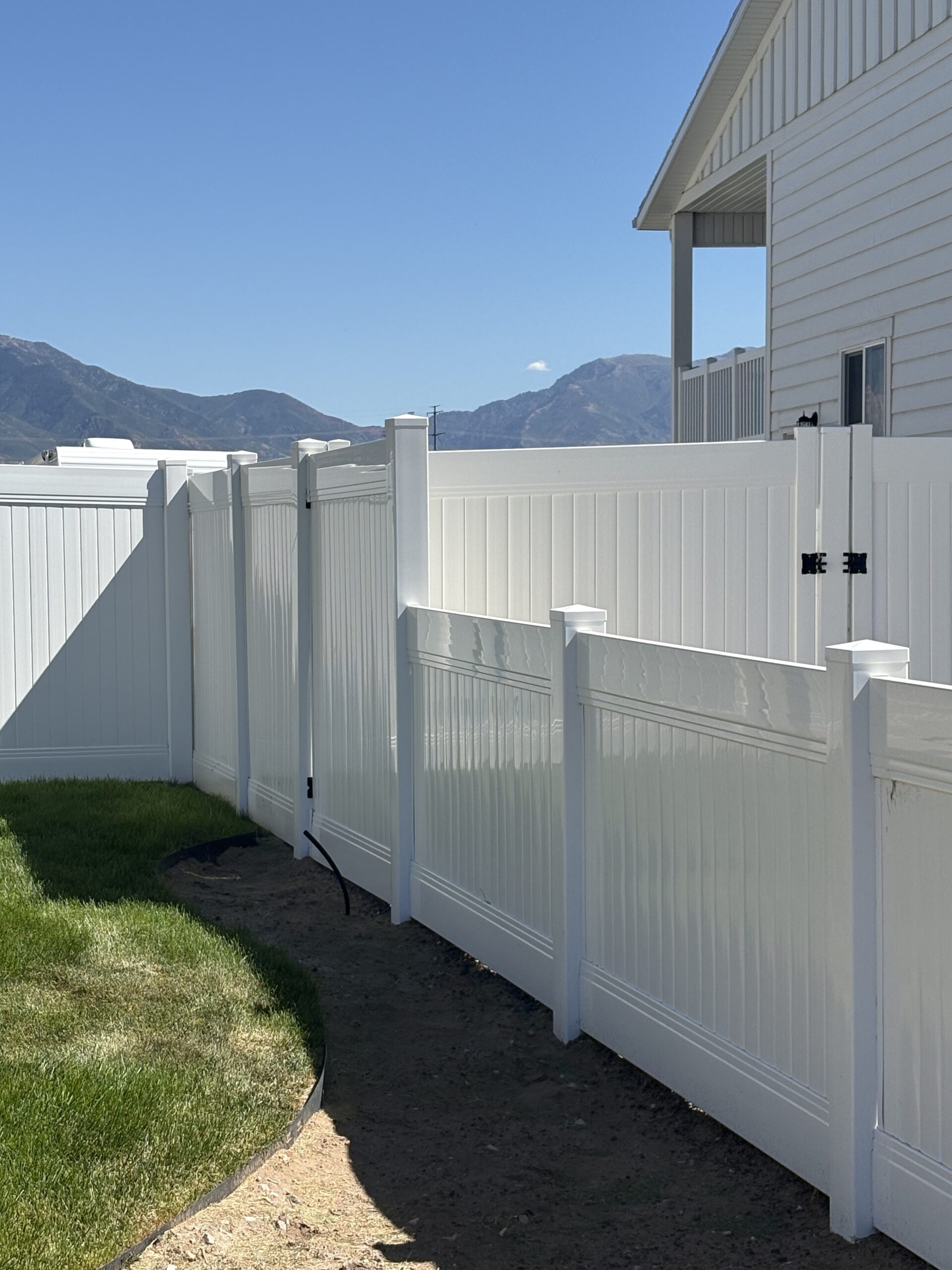 Durable White Vinyl Privacy Fence and Mowstrip in West Haven