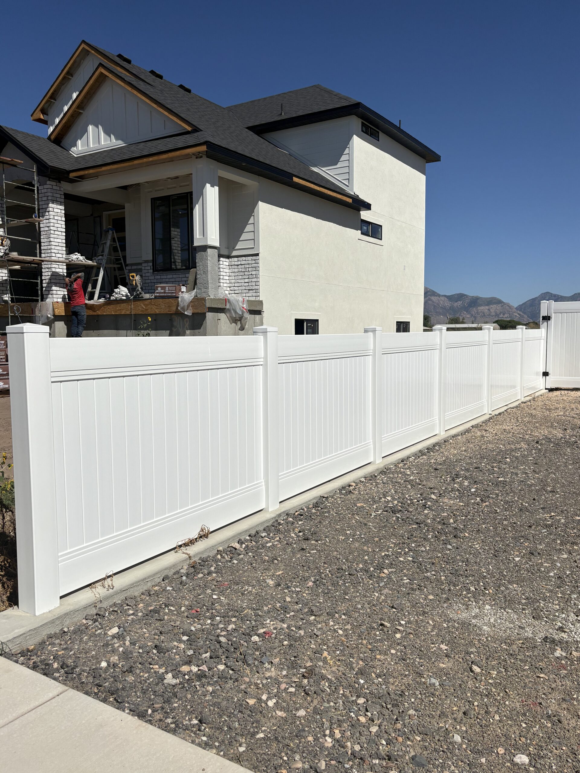 Durable White Vinyl Privacy Fence and Mowstrip in West Haven