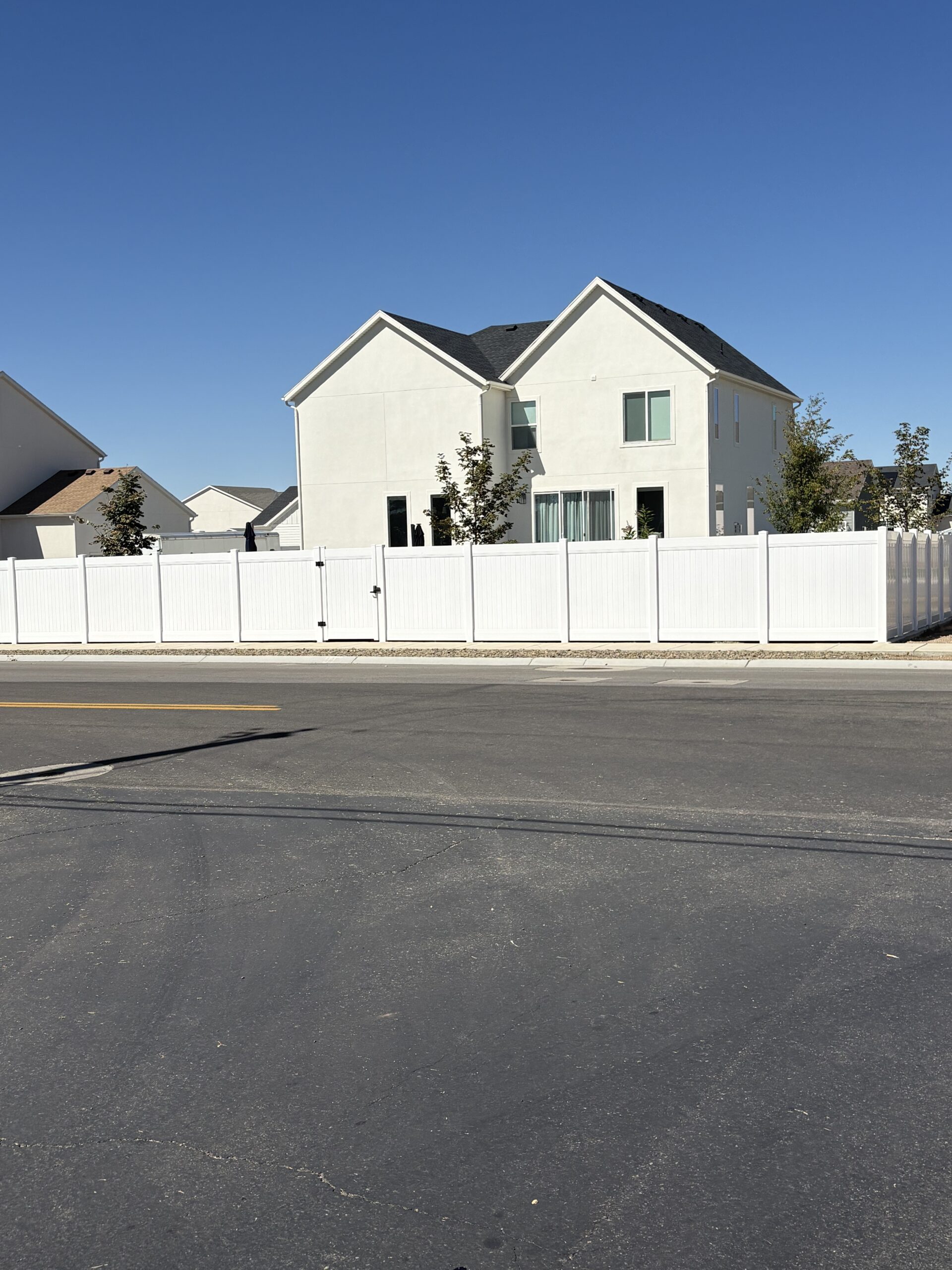 Durable White Vinyl Privacy Fence with Custom Gates in West Haven