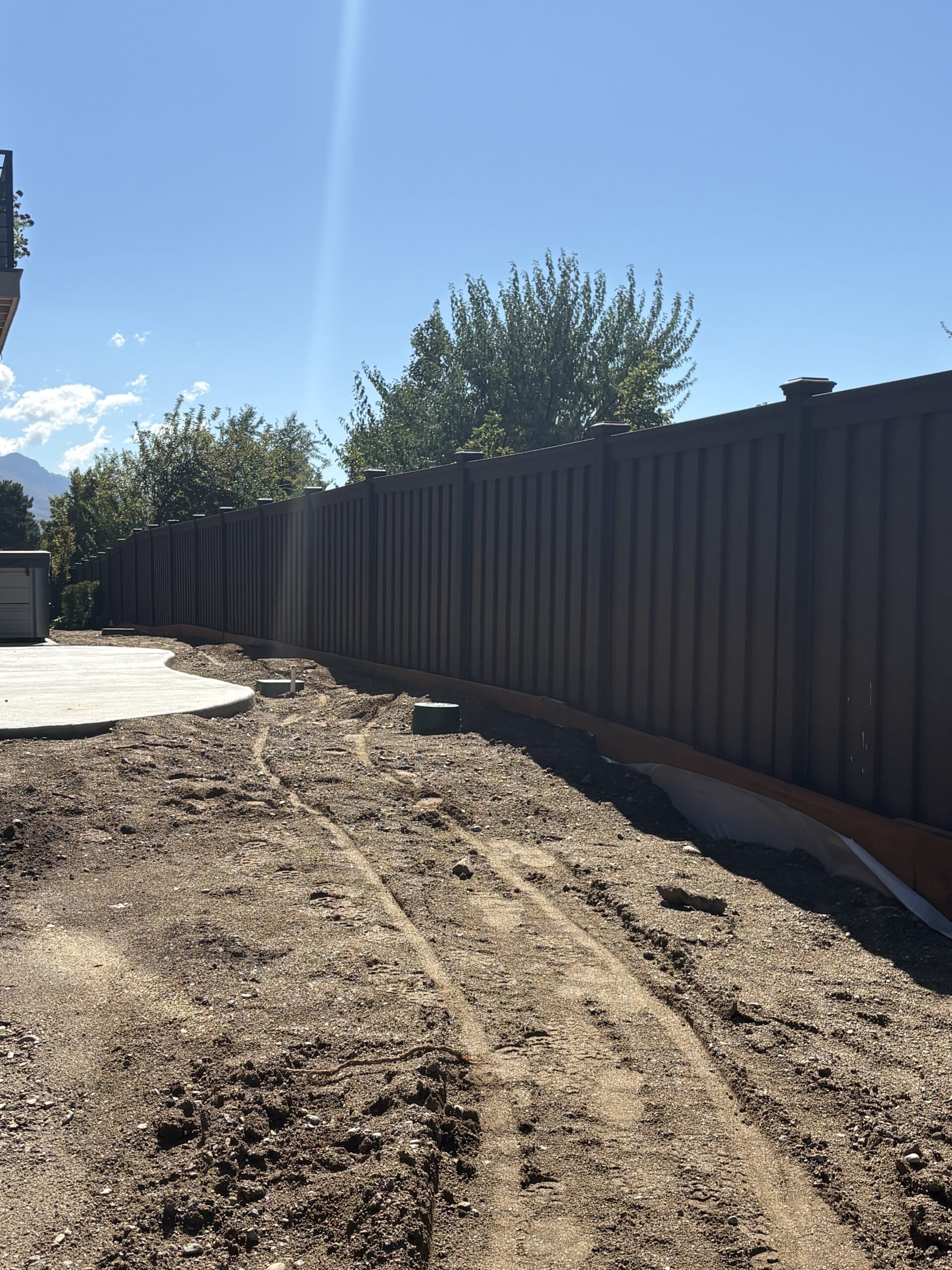 Recent Projects Durability Meets Privacy: Woodland Brown Trex Seclusions Fence in Ogden
